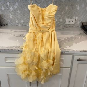 The limited event dress strapless pockets with flower overlay